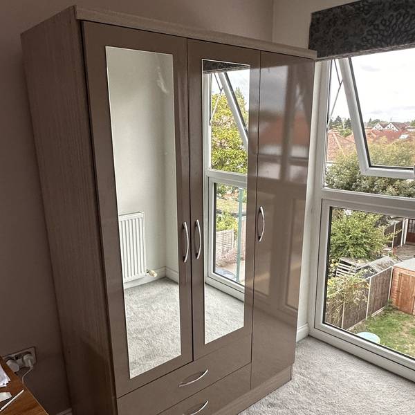 Mirrored wardrobe fitted in a bedroom